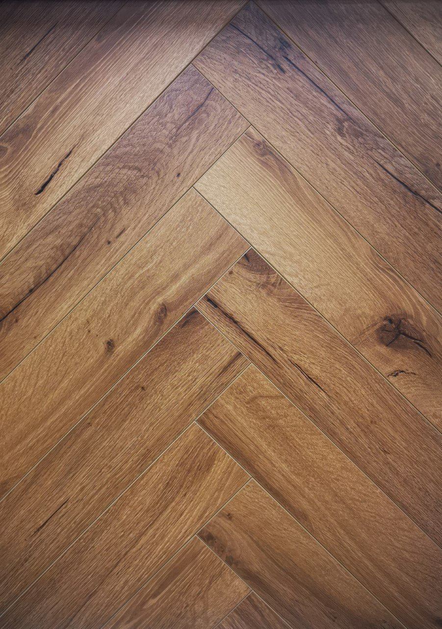 Elevate Your Space with 12mm Smoked Oak Herringbone Flooring: A Timeless Aesthetic Choice